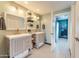 Modern bathroom with double vanity and black and white tile floor at 7902 E Heatherbrae Ave, Scottsdale, AZ 85251