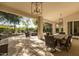 Covered patio with wicker dining set and view of backyard at 8713 E Voltaire Ave, Scottsdale, AZ 85260