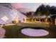 Private putting green with sand trap and exterior lighting at 8713 E Voltaire Ave, Scottsdale, AZ 85260