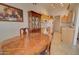 Cozy dining area with wood table, hardwood floors, and natural light at 1041 N 91St Pl, Mesa, AZ 85207