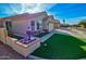 Well-kept home features a manicured lawn, flower bed and an attached two-car garage at 1041 N 91St Pl, Mesa, AZ 85207