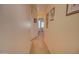 A hallway with a bedroom in the background at 1041 N 91St Pl, Mesa, AZ 85207