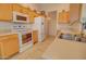 A kitchen with a stainless steel sink and oven at 1041 N 91St Pl, Mesa, AZ 85207