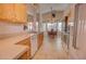 Bright kitchen with modern appliances, tile flooring, and seamless flow into the dining area at 1041 N 91St Pl, Mesa, AZ 85207