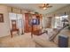 Relaxing living room featuring neutral carpet, stylish decor, and plenty of room for entertaining at 1041 N 91St Pl, Mesa, AZ 85207