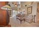 Spacious living room featuring neutral carpet, comfortable seating, and ample natural light at 1041 N 91St Pl, Mesa, AZ 85207