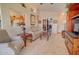 Open living room showcases a cozy sitting area, neutral carpet, and seamless flow to other spaces at 1041 N 91St Pl, Mesa, AZ 85207