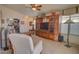 Inviting living room with plush carpet, a built-in entertainment center, and a relaxing atmosphere at 1041 N 91St Pl, Mesa, AZ 85207