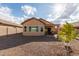 Home's backyard with gravel and plants at 10454 E Peralta Canyon Dr, Gold Canyon, AZ 85118