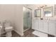 Bathroom with double vanity, large mirror and shower at 10454 E Peralta Canyon Dr, Gold Canyon, AZ 85118