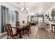 Open dining room with hardwood floors and view of living room at 10454 E Peralta Canyon Dr, Gold Canyon, AZ 85118