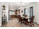 Bright dining area with chandelier and view of the kitchen at 10454 E Peralta Canyon Dr, Gold Canyon, AZ 85118