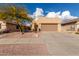 Desert landscape home with driveway and two-car garage at 10454 E Peralta Canyon Dr, Gold Canyon, AZ 85118