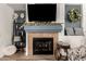 Living room fireplace with decorative mantle and hearth at 10454 E Peralta Canyon Dr, Gold Canyon, AZ 85118