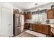 Modern kitchen with stainless steel appliances and wood cabinets at 10454 E Peralta Canyon Dr, Gold Canyon, AZ 85118