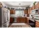 Modern kitchen featuring stainless steel appliances and wood cabinetry at 10454 E Peralta Canyon Dr, Gold Canyon, AZ 85118