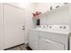 Laundry room with Whirlpool washer and dryer, and shelving at 10454 E Peralta Canyon Dr, Gold Canyon, AZ 85118