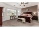 Spacious main bedroom with a ceiling fan and large windows at 10454 E Peralta Canyon Dr, Gold Canyon, AZ 85118