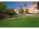 Landscaped backyard with firepit and citrus tree at 10730 E Medina Ave, Mesa, AZ 85209