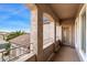 Private balcony overlooks neighborhood with a door leading inside at 10730 E Medina Ave, Mesa, AZ 85209