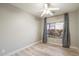 Bright bedroom with wood floors and window view at 10730 E Medina Ave, Mesa, AZ 85209