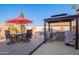 Spacious backyard deck with built-in grill and seating at 10921 W Bermuda Dr, Avondale, AZ 85392