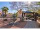 Relaxing backyard with fountain, gazebo, and lush landscaping at 10921 W Bermuda Dr, Avondale, AZ 85392