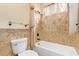 Small bathroom with beige tile and a shower/tub combo at 10921 W Bermuda Dr, Avondale, AZ 85392