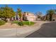 Two-story house with a two-car garage and nicely landscaped yard at 10921 W Bermuda Dr, Avondale, AZ 85392