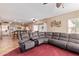 Open Gathering room with a view of the kitchen and breakfast bar at 10921 W Bermuda Dr, Avondale, AZ 85392