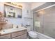 Bright bathroom with a shower, vanity, and mirrored cabinet at 11008 W Cherry Hills W Dr, Sun City, AZ 85351