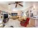 Spacious living room featuring tile flooring, a ceiling fan, and comfortable seating arrangement at 11008 W Cherry Hills W Dr, Sun City, AZ 85351