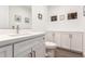 Simple yet stylish powder room with a single sink and storage at 11673 N 136Th St # 1021, Scottsdale, AZ 85259