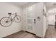 Bright and airy entryway with modern door and wall decor at 11673 N 136Th St # 1021, Scottsdale, AZ 85259