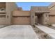 Modern building exterior with attached garage and desert landscaping at 11673 N 136Th St # 1021, Scottsdale, AZ 85259