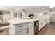 Modern kitchen island with white cabinets and stainless steel appliances at 11673 N 136Th St # 1021, Scottsdale, AZ 85259