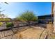 Backyard with covered patio and mature trees at 12021 W Locust Ln, Avondale, AZ 85323