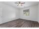 Bedroom featuring wood-look floors and a ceiling fan at 12021 W Locust Ln, Avondale, AZ 85323