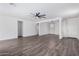 Spacious living room with hardwood floors and ceiling fan at 12021 W Locust Ln, Avondale, AZ 85323