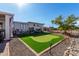 Relaxing backyard with putting green and gravel landscaping at 12406 W Allegro Dr, Sun City West, AZ 85375