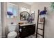 Bathroom with single vanity, granite countertop, and decorative ladder at 12406 W Allegro Dr, Sun City West, AZ 85375