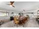 Large dining room with a long wooden table and seating for many at 12406 W Allegro Dr, Sun City West, AZ 85375