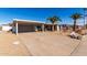 House exterior showcasing a carport and desert landscaping at 12406 W Allegro Dr, Sun City West, AZ 85375