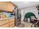 Kitchen with stainless steel refrigerator and wood cabinets at 12406 W Allegro Dr, Sun City West, AZ 85375