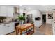 Well-equipped kitchen featuring white cabinets, a gas range, and ample counter space at 12406 W Allegro Dr, Sun City West, AZ 85375