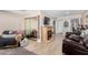 Living room featuring a fireplace, comfortable seating, and hardwood floors at 12406 W Allegro Dr, Sun City West, AZ 85375