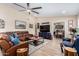 Bright and airy living room with a comfortable leather sectional and a stylish coffee table at 12406 W Allegro Dr, Sun City West, AZ 85375