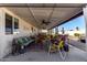 Relaxing covered patio with seating and outdoor furniture at 12406 W Allegro Dr, Sun City West, AZ 85375