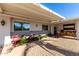 Covered porch with seating area and welcoming decor at 12406 W Allegro Dr, Sun City West, AZ 85375