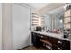 Bathroom vanity with granite countertop and ample storage at 12406 W Allegro Dr, Sun City West, AZ 85375